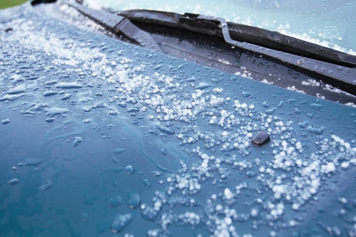 Hailstones Melting on Car Hood