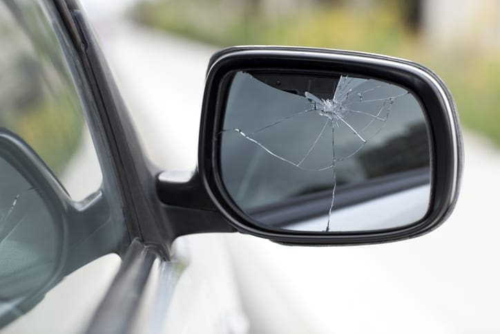 Passenger side view mirror cracked and broken.