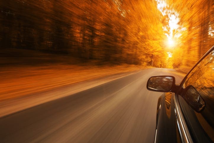 Car on the autumn road